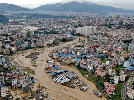 Rescuers use zip lines and boats to reach survivors as Nepal flooding and landslides kill nearly 200 people