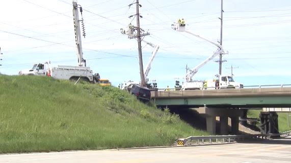 Decatur crash leaves SUV dangling off overpass