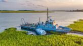 An abandoned 120-foot US Navy ship is stuck in a Johns Island creek. How did it get there?