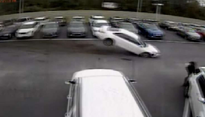 Out-of-control vehicle caught on camera flying into car dealership