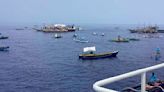 About 100 Filipino activists and fishermen sail on wooden boats to disputed shoal guarded by China