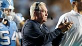 Former Texas coach Mack Brown becomes the first coach to win 100 games at two FBS schools