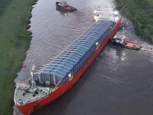 Cargo ship freed after becoming stuck in river