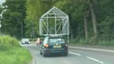 Car with huge greenhouse frame attached to roof leaves UK town in stitches