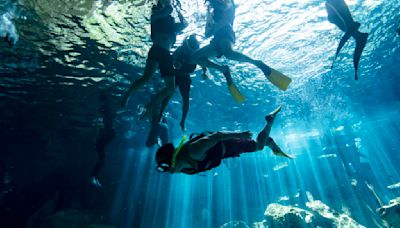 In Mexico's Yucatan Peninsula, a hidden underground world is under threat by the Maya Train