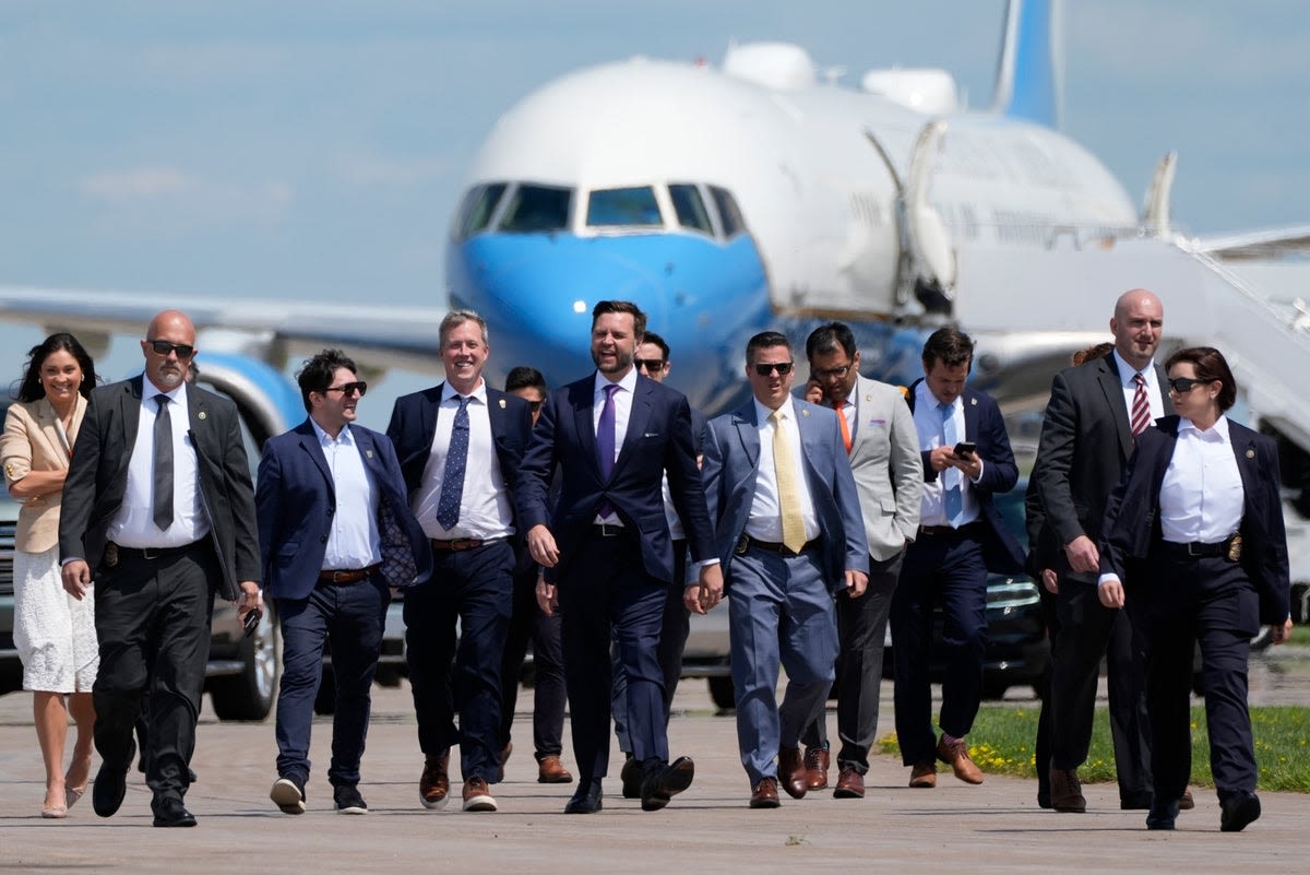 Awkward moment JD Vance attempts to confront Kamala on tarmac – before holding presser in front of Air Force 2