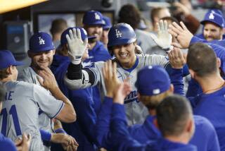 Shohei Ohtani pulled from Dodgers lineup due to tightness in his back