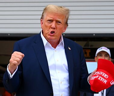 Donald Trump waves to crowd and visits McLaren garage at F1 Miami Grand Prix