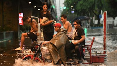 Taiwan prepares for Typhoon Gaemi that worsened monsoon rains in the Philippines, killing 12