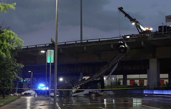 18-wheeler hangs over downtown Dallas bridge after crash, officials say