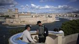 A ship carrying the Olympic torch arrives in Marseille amid fanfare and high security - WTOP News