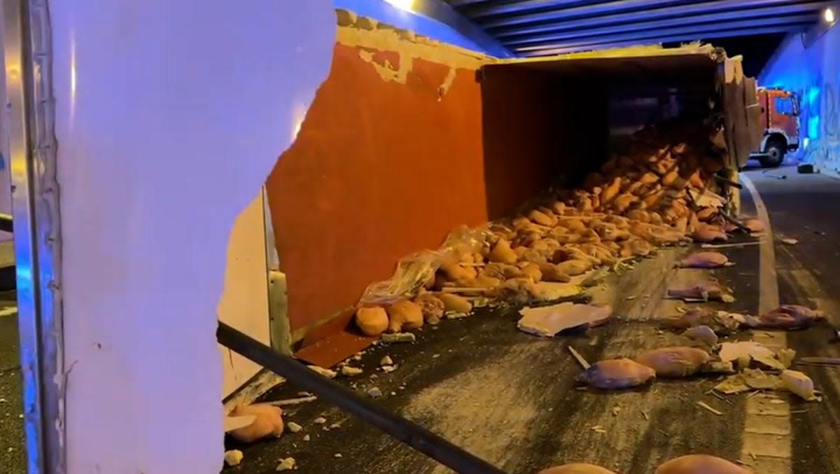 30 tonnes of ham scattered across road after lorry overturns in Madrid tunnel