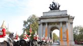 Three arrested after Just Stop Oil spray orange paint over London’s Wellington Arch