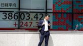 Stock market today: Asian shares advance after another round of Wall St records