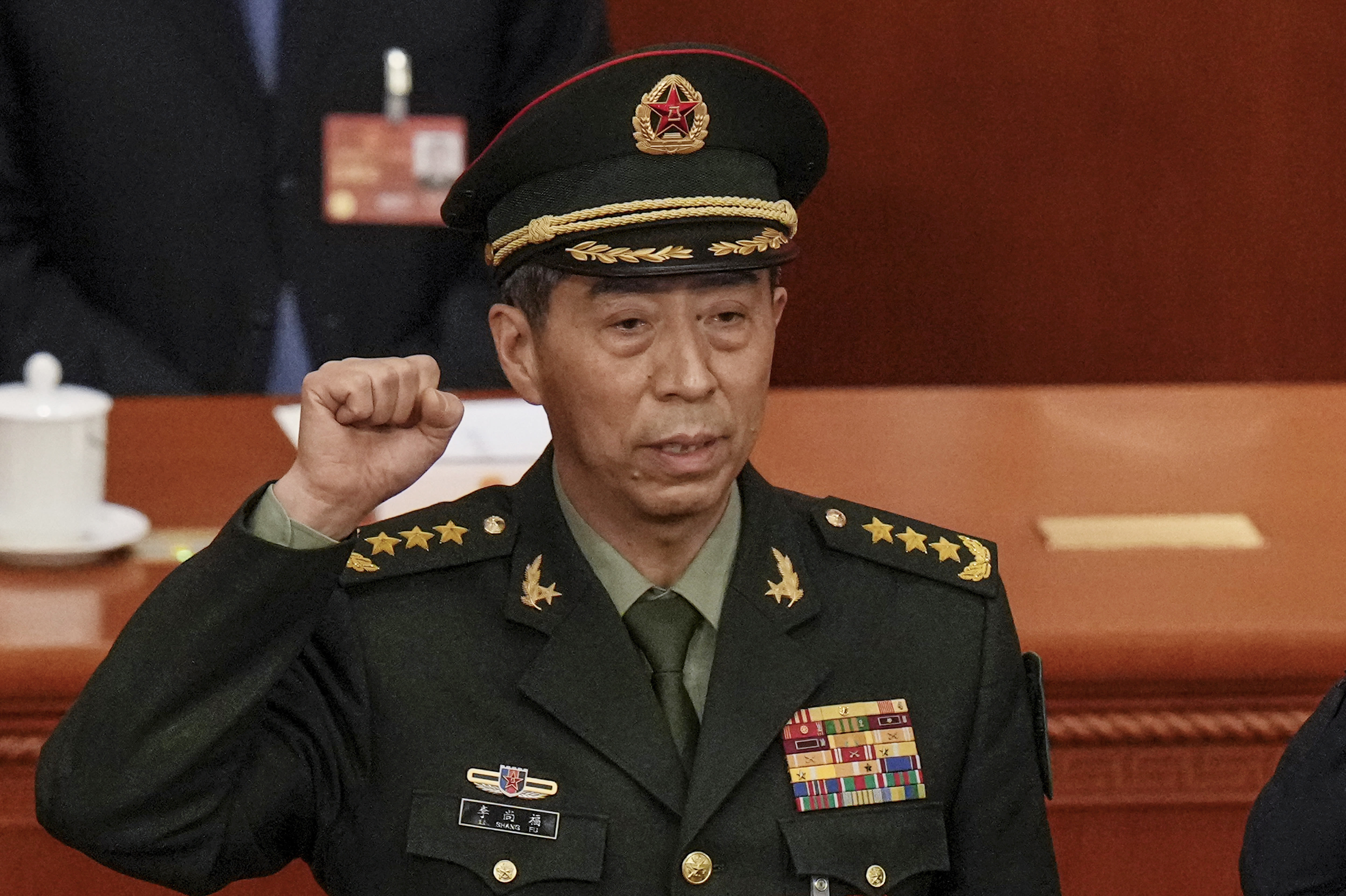 China expels 2 former defense ministers from its ruling Communist Party over graft allegations