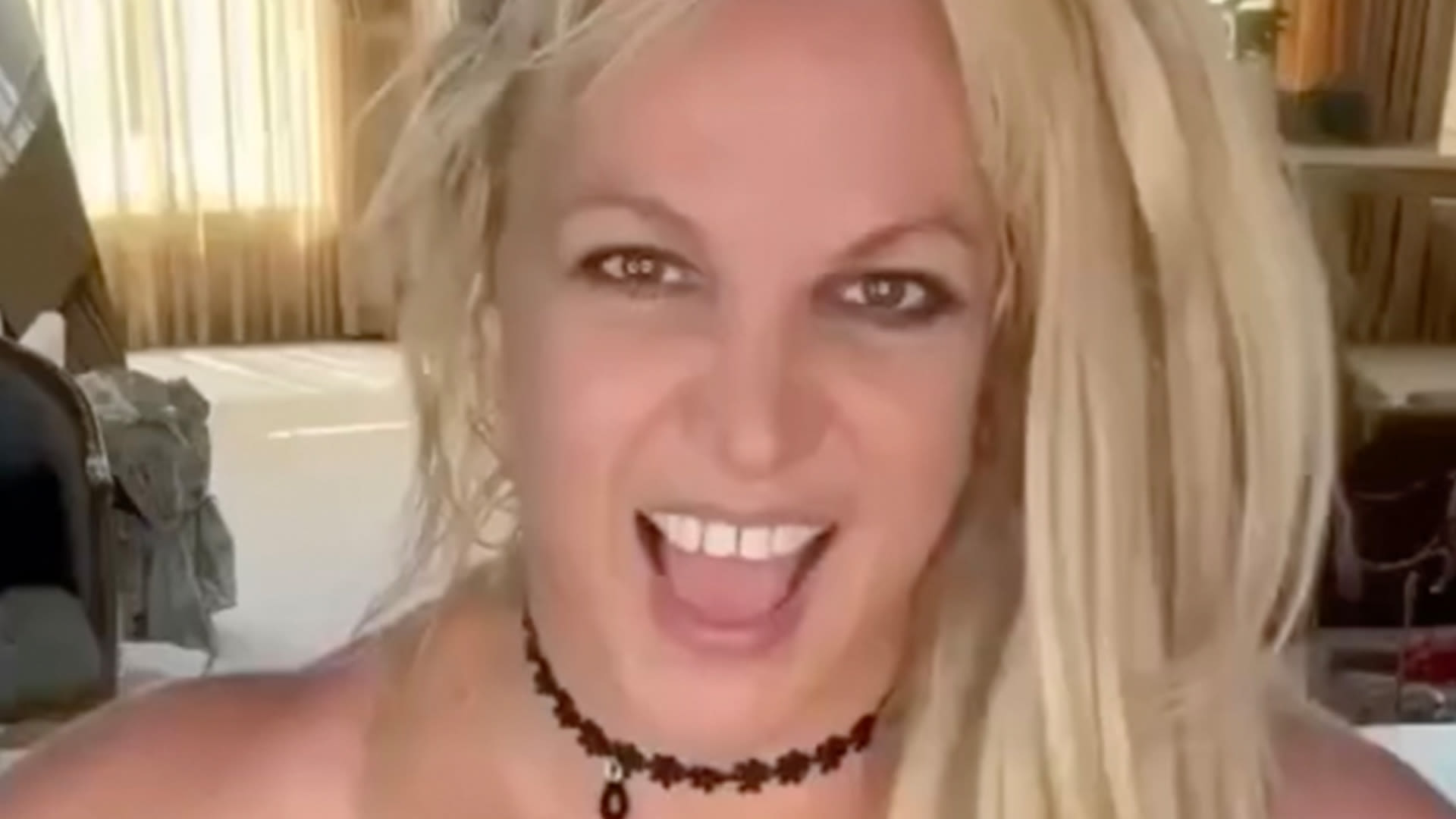 Britney Spears says it's 'good to be alive' as she rides horse in tiny bikini