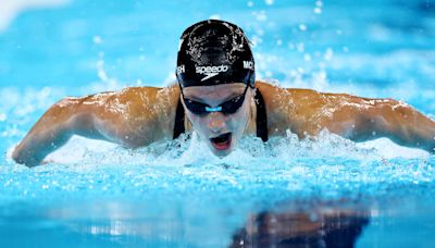 Swimming-McIntosh eases into 200m semi-finals, Britain's Greenbank disqualified