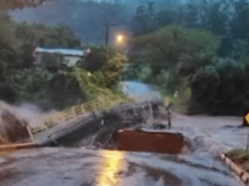 Bridge washes away on video as mayor warns of floods