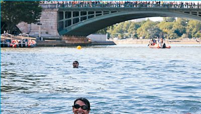 Paris mayor goes for a swim to prove Seine clean enough for showpiece