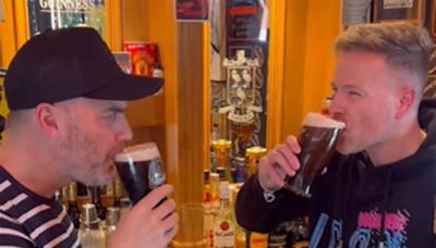 Gary Barlow learns how to pull the perfect pint in Nicky Byrne's home