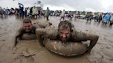 ‘Someone stole my wellies!’: Glastonbury’s five muddiest festivals