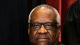 Associate Justice Clarence Thomas sits during a group photo of the Justices at the Supreme Court in Washington, DC in 2021