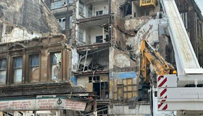 Ghost sign of old shop appears as Glasgow building is demolished