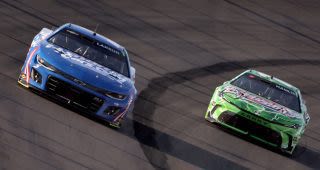 Kyle Larson wrecks into Denny Hamlin after contact with Daniel Suárez at Iowa