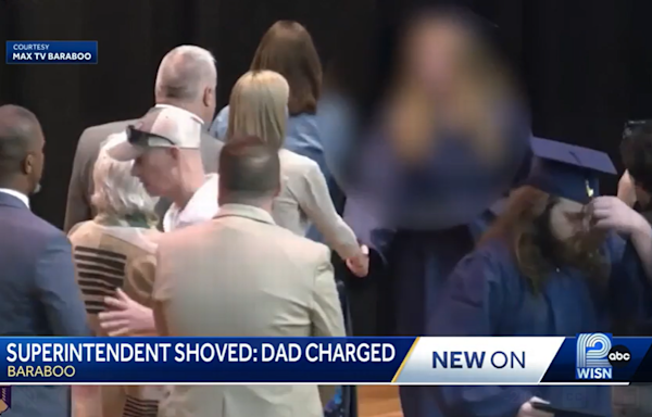 Dad pushes superintendent away from graduating daughter, video shows. He’s charged