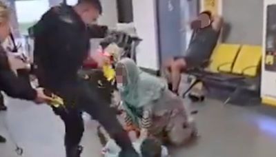 Police officer suspended from all duties after footage of man kicked in face at Manchester Airport