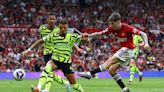 Soccer-Arsenal reclaim provisional top spot with 1-0 win at Man United