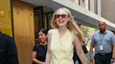 Dakota Fanning Pairs a Buttery Suit Set With a Coded Luxury Status Symbol