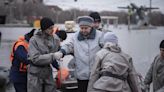 Russians stage a rare protest after a dam bursts and homes flood near the Kazakh border