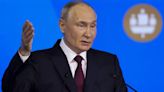 Putin says Russia’s economy is growing despite heavy international sanctions as he courts investors