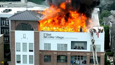 Evacuated residents emotional after their homes burned in apartment fire on Howell Mill Road