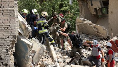 Live view of Kyiv children’s hospital as rescuers search for survivors after Russian missile attack