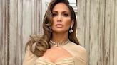 Jennifer Lopez cuts an elegant figure in a busty gold gown