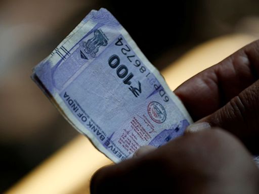 Rupee holds just above all-time low as state-run banks' dollar sales support