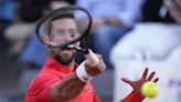 Djokovic wins his opener at the Italian Open after a month off. Defending champ Rybakina withdraws - WTOP News