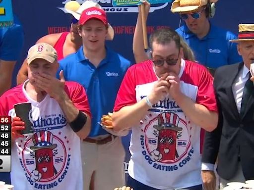 Hot Dog Eating Contest: Man Eats 58 Hot Dogs In 10 Minutes To Win The Mustard Belt And $20,000 Prize