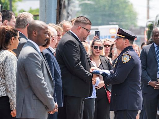 Off-duty NYPD officer who was among 4 killed when drunk driver crashed into nail salon laid to rest