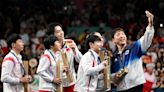 Olympic podium selfie unites North and South Korean athletes