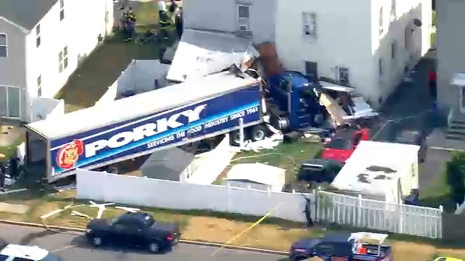 Tractor-trailer crashes into homes in Carteret after driver suffers medical episode