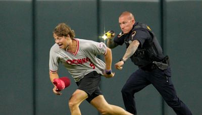 Charges dropped against Reds fan who ran onto field, did backflip before getting Tased