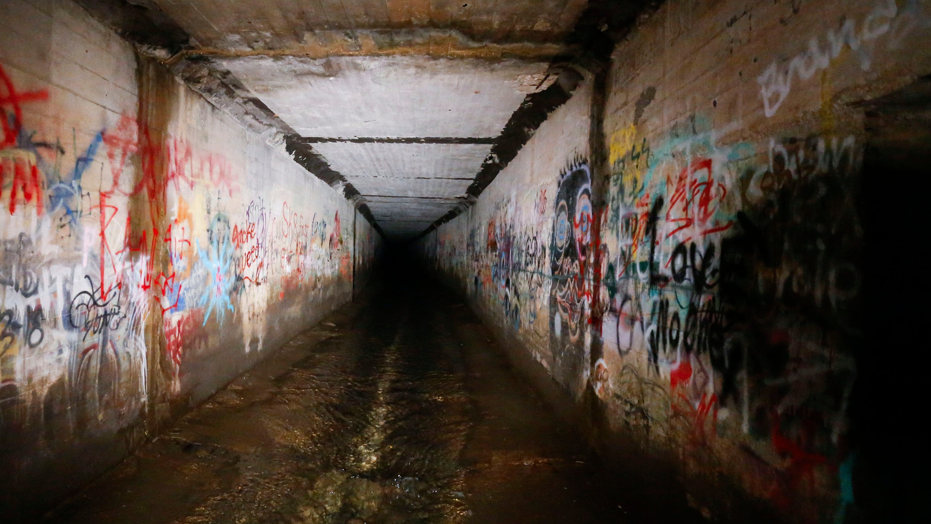 Murky water, colorful graffiti and a long history: Uncovering the Jordan Creek Tunnels