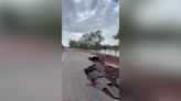 Massive chunk of road swept away after record-breaking flooding in Australia