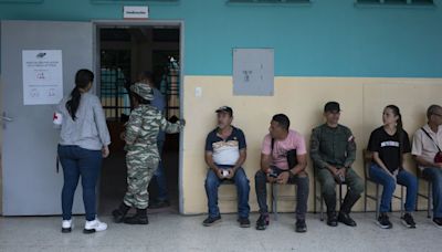 Venezuelans vote in crucial presidential election as opposition signal high voter turnout