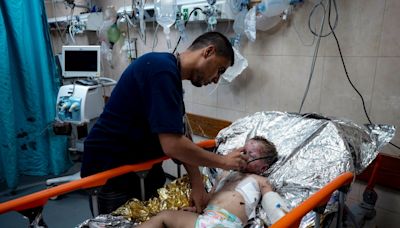 Wounded in a strike that killed her family, a 2-year-old joins Gaza’s ranks of thousands of orphans