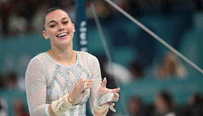 2024 Paris Olympics: Italian gymnast poses with giant wheels of cheese, thanks to parmesan sponsorship