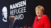 Merkel praises others as she accepts UN refugee agency award